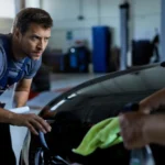 Professional auto detailer preparing a service quotation based on vehicle condition, detailing requirements, labour, and products