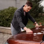 Professional automotive paint protection on a car exposed to sunlight, rain and rough road conditions, highlighting the importance of PPF and detailing.